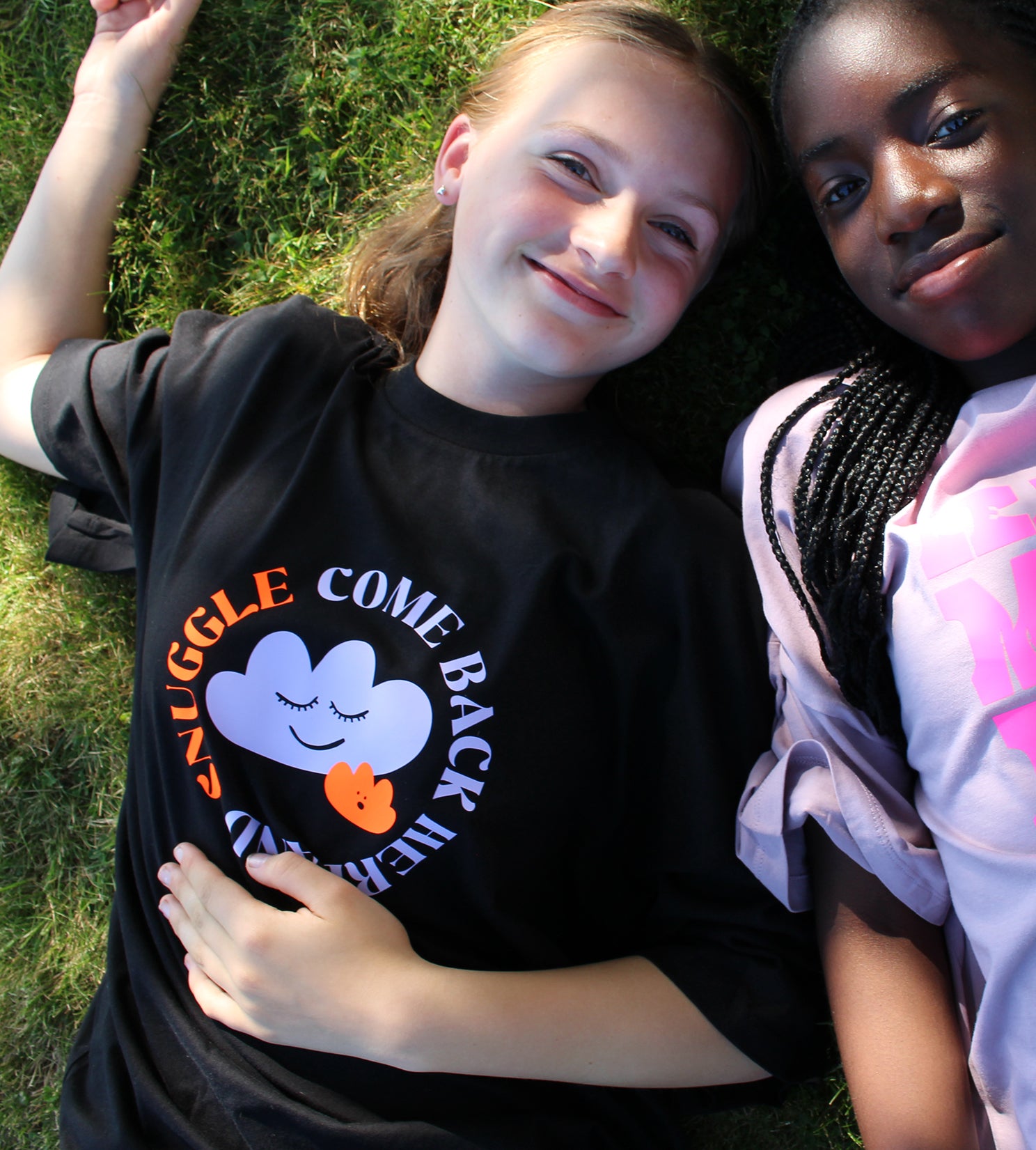 Two teen girls smiling wearing That's Sooo You t-shirts, tees, come back here and snuggle, black, lilac, orange, pink