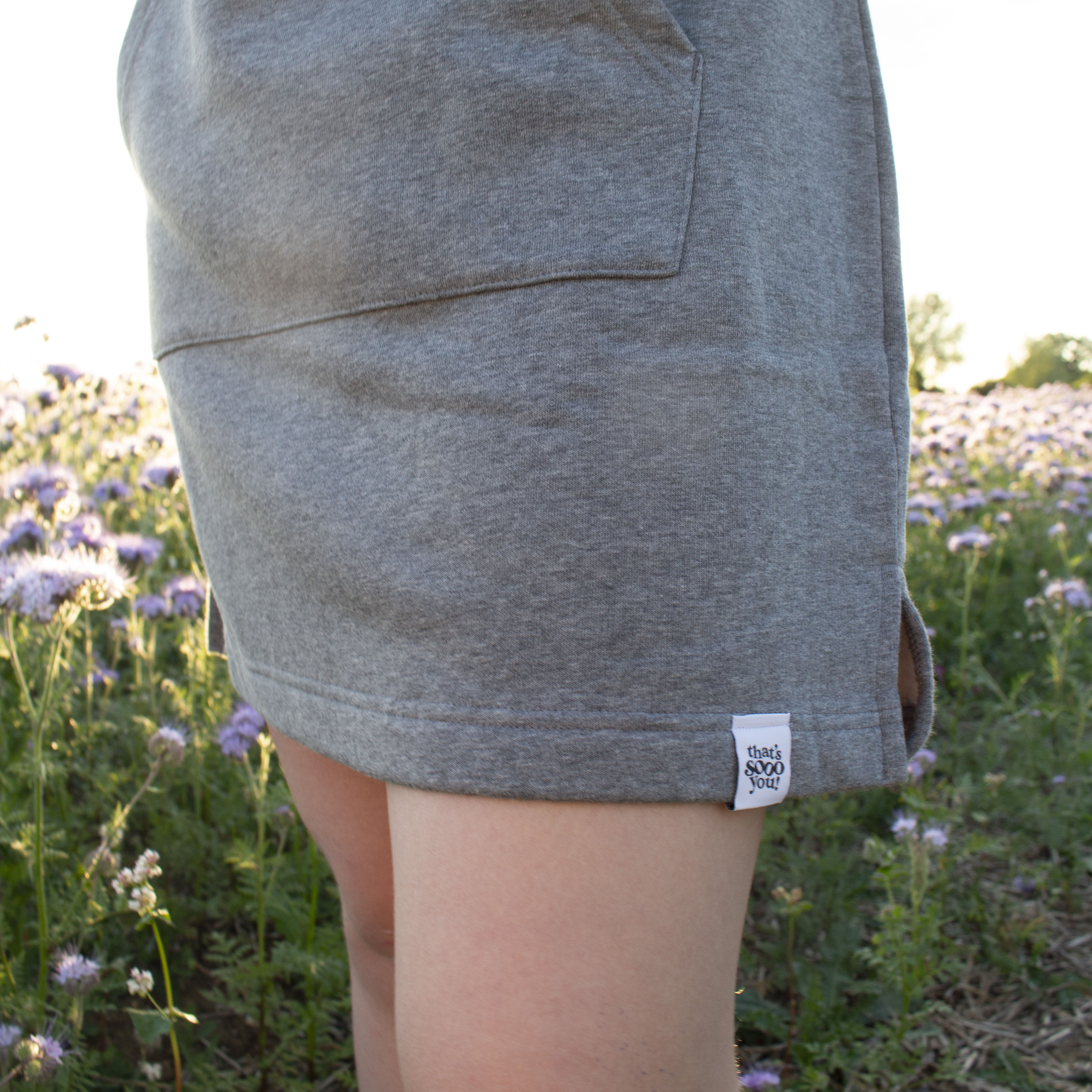 That's Sooo You Logo Dark Grey Longline Sweatshirt Dress, Rainbow Flower Design on Back and Chest, Field, purple flowers, sunset, golden hour, hand sewn fabric label