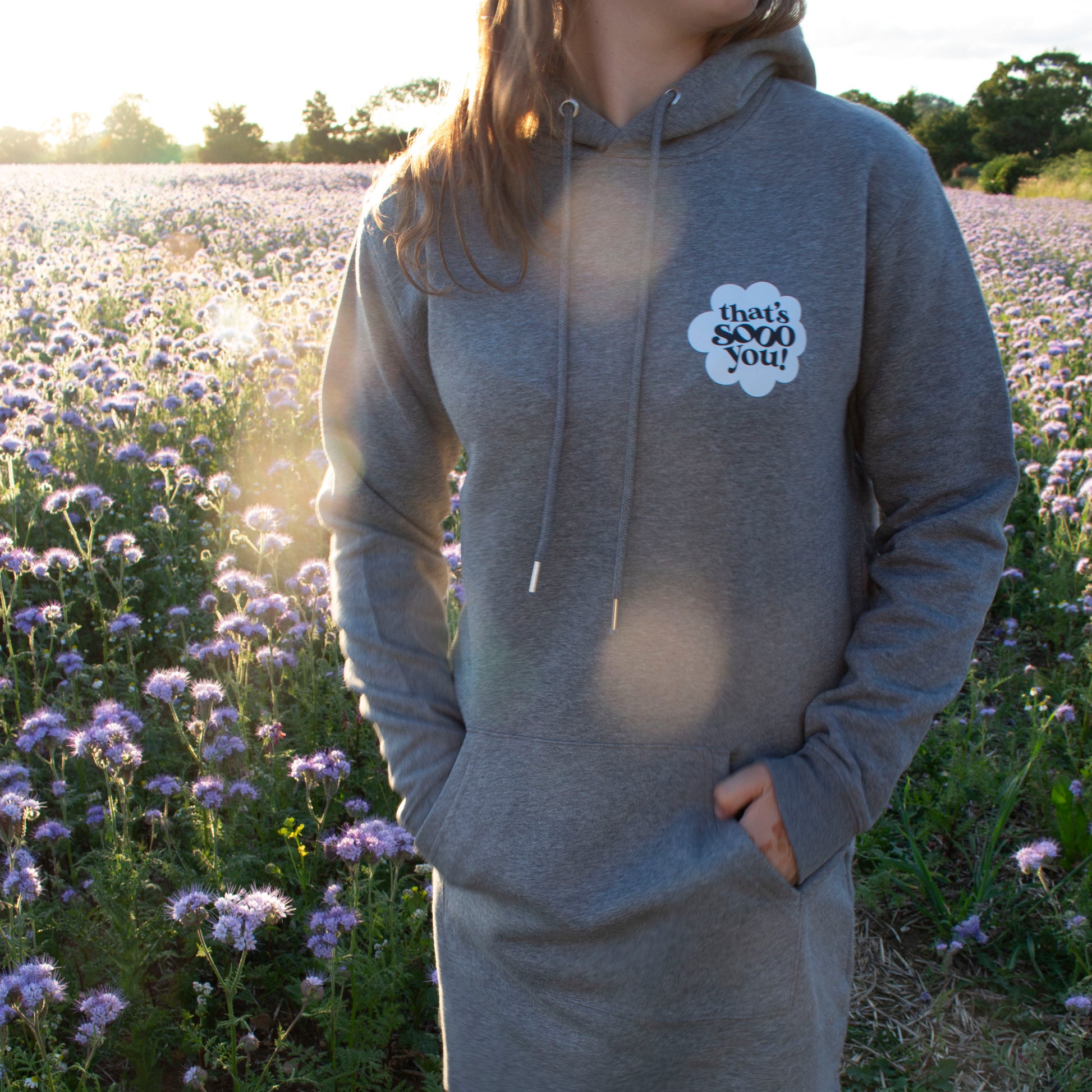 That's Sooo You Logo Dark Grey Longline Sweatshirt Dress, Rainbow Flower Design on Back and Chest, Field, purple flowers, sunset, golden hour